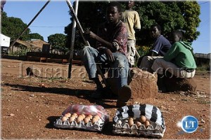 A boy selling boiled eggs in Katete to raise money for his school fees