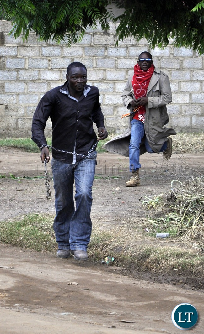 PF-militia...a-PF-youth-wielding-a-dangerous-weapon-goes-for-UPND-cadres-during-the-Kabwata-violence